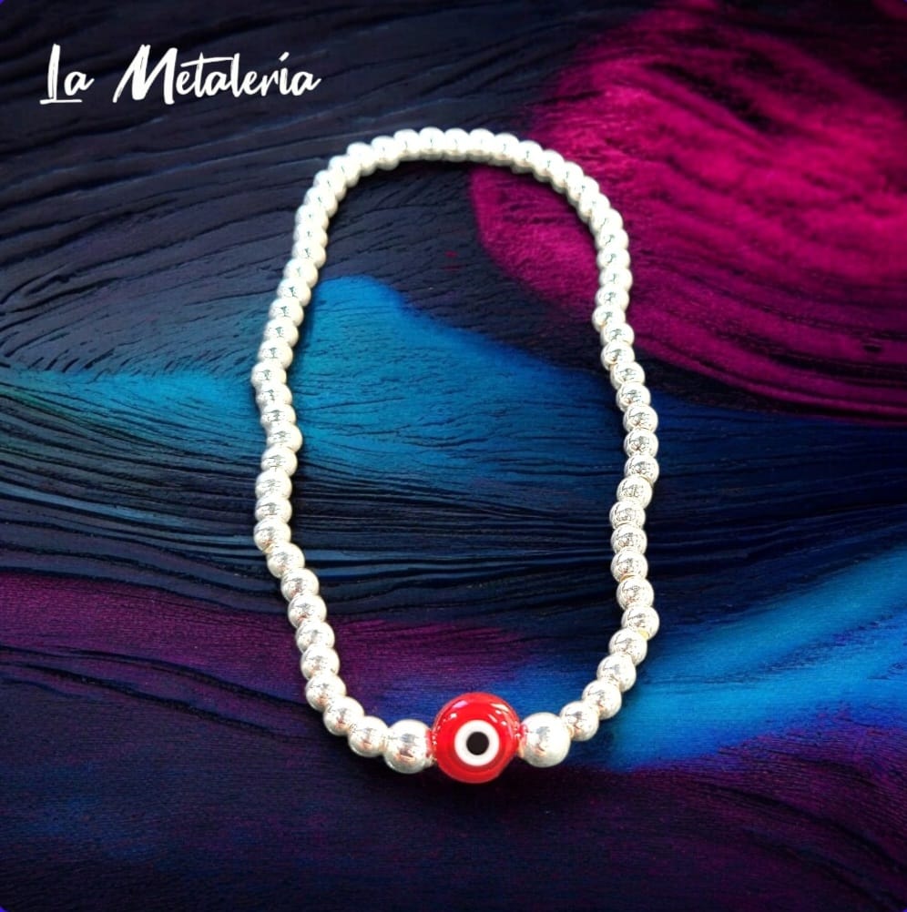 Pulsera Bolitas de Plata y Ojito Rojo