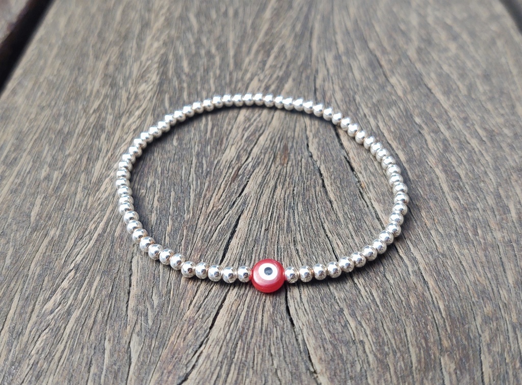 Pulsera Bolitas de Plata y Ojito Rojo